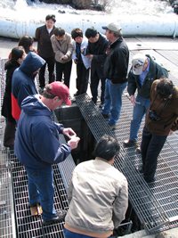 Chinese Fishery delegation tours Lyle Falls adult fish trap with YKFP staff